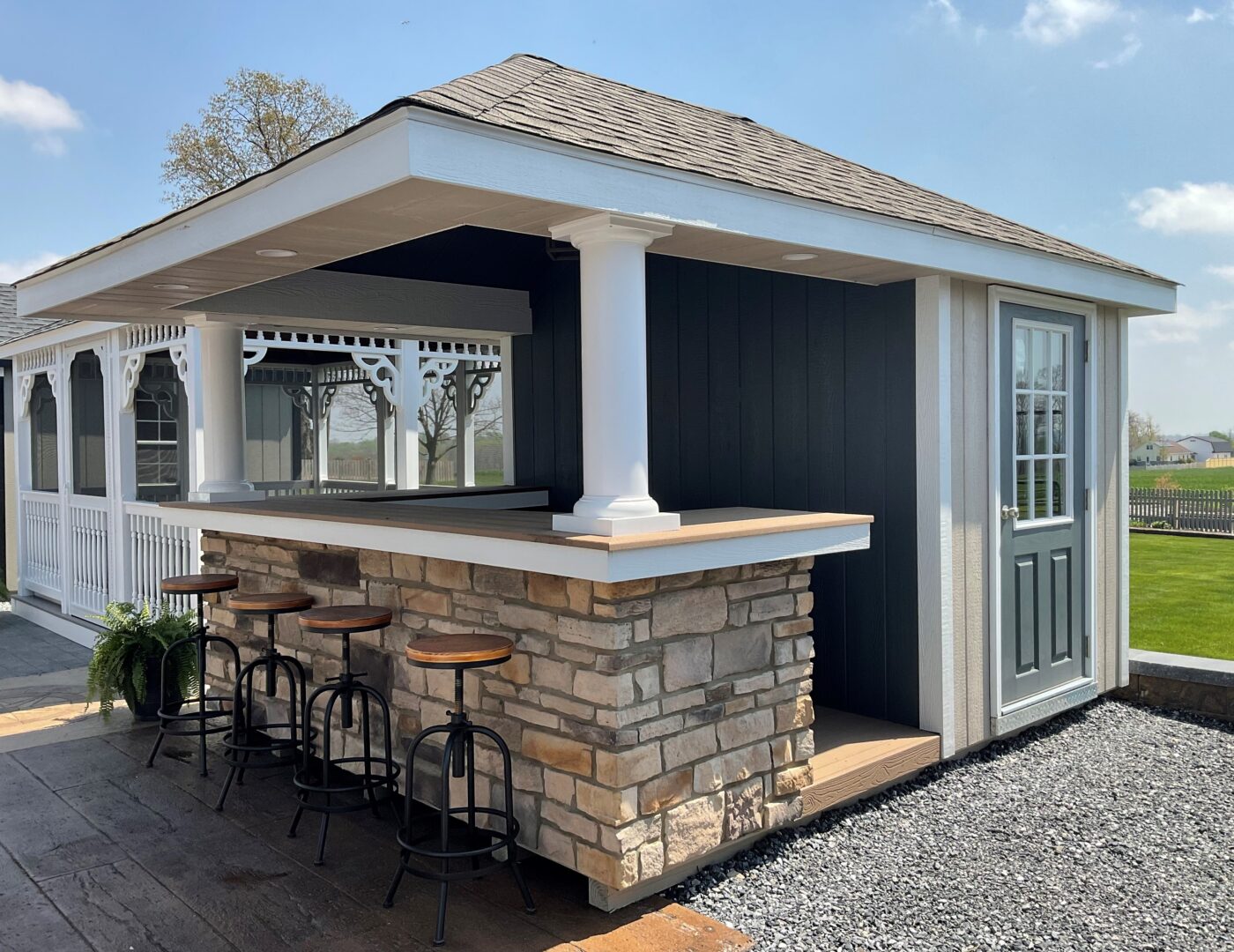 hip roof cabana with stone detailing in bar area