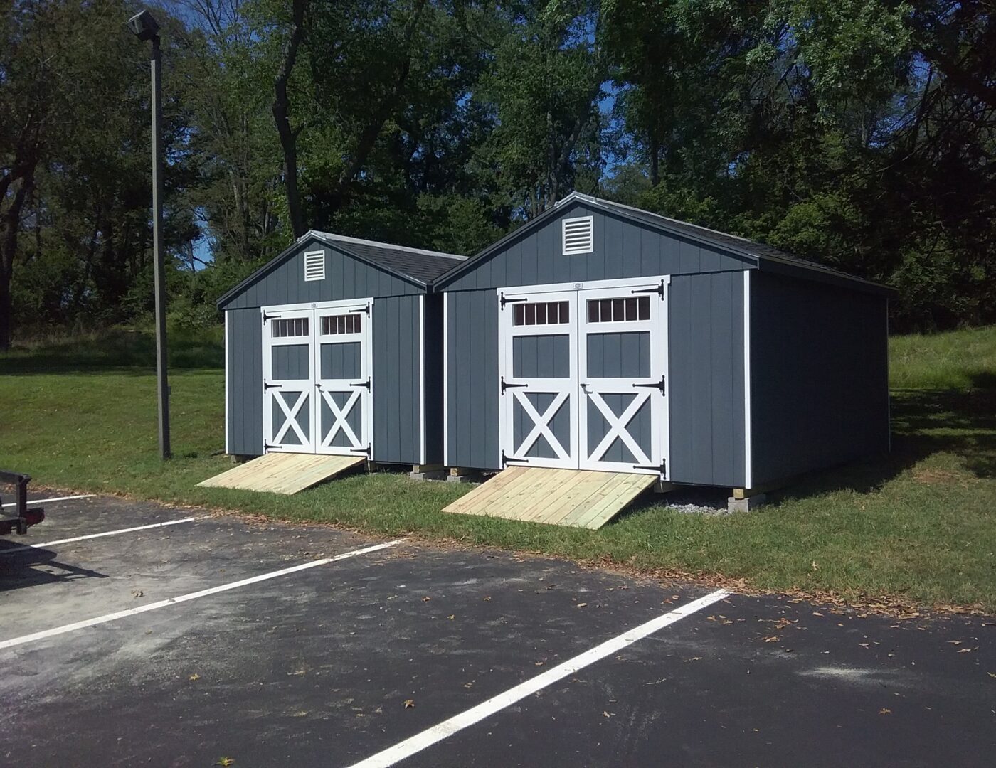 Two 12x15 Painted Cottages with ramps side by side