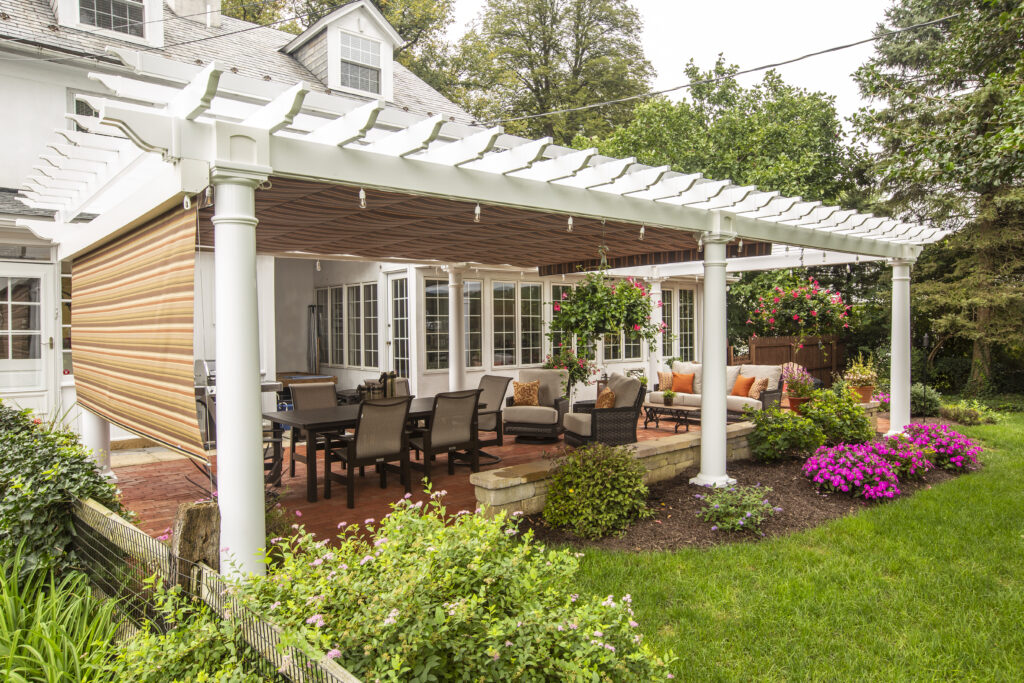 artisan vinyl pergola over an outdoor dining table