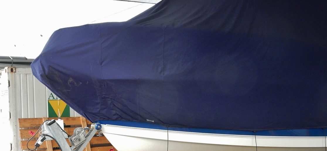 boat with a cover in a garage
