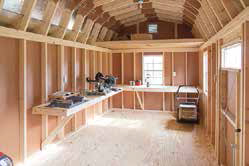 interior of shed with a workbench and a loft, turn a shed into a workshop