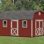 red dutch barn shed with white trim