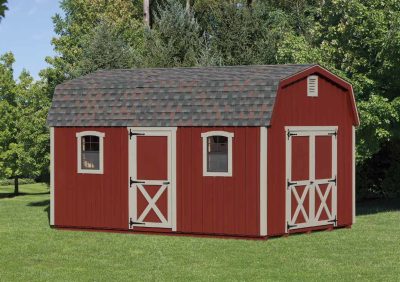 red dutch barn shed with white trim