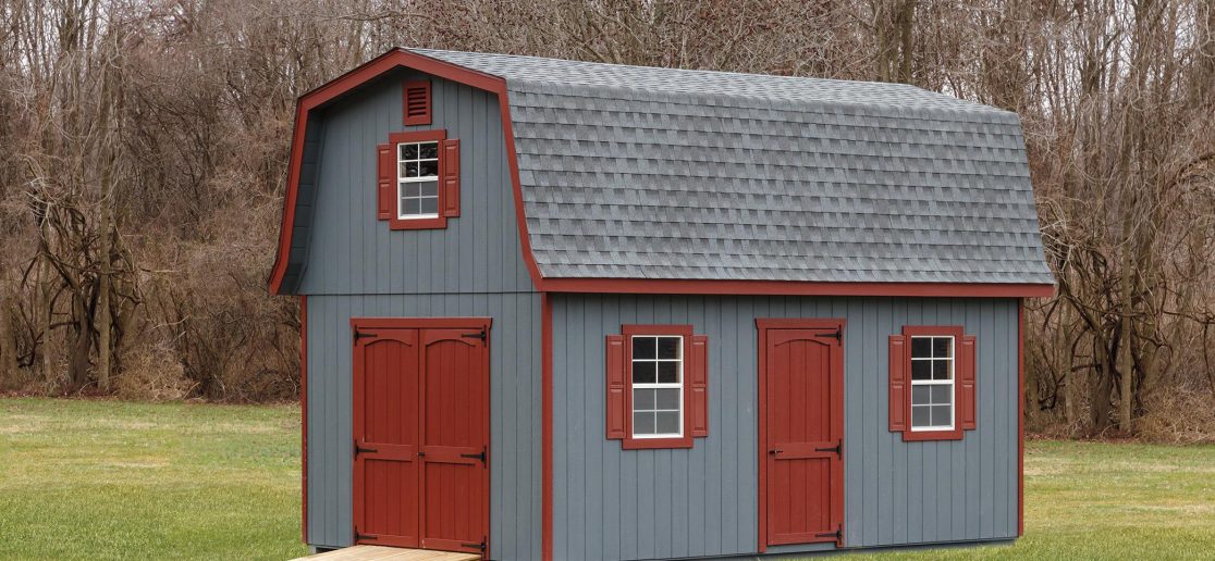 elite classic dutch barn shed with blue siding and red doors and shutters