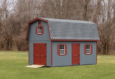 elite classic dutch barn shed with blue siding and red doors and shutters
