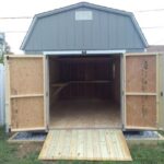 dutch barn shed with the double doors wide open with a ramp