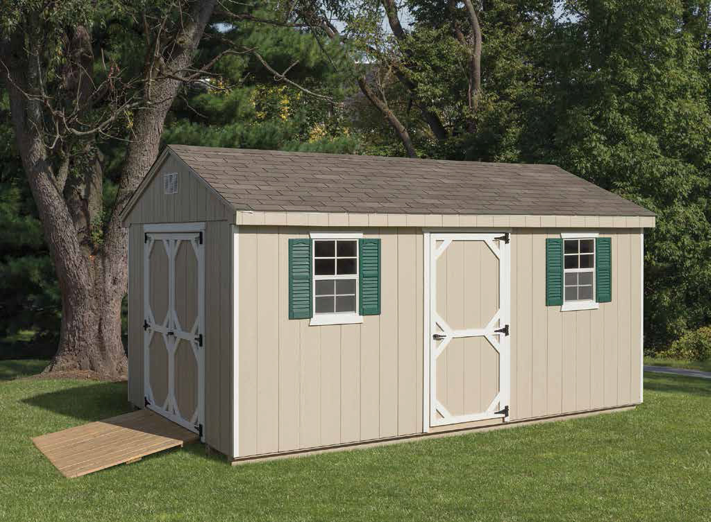 cottage series shed with tan siding, green shutters, ramp, and white door trim